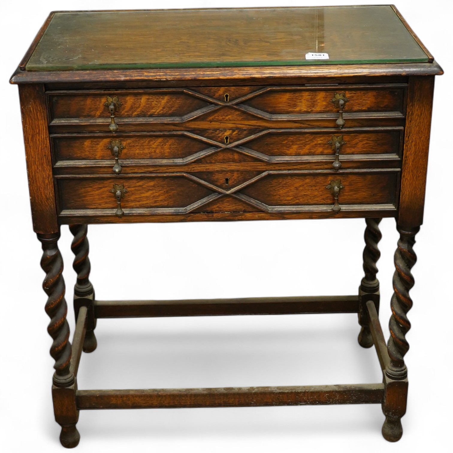 A 1920’s canteen of Old English pattern flatware, housed in a Queen Anne style oak cabinet, 87cm high